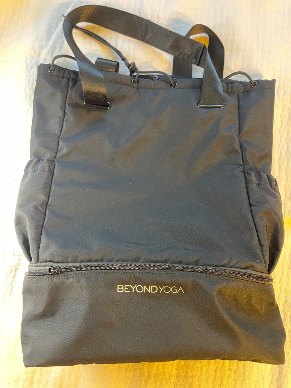 Black Beyond Yoga adjustable backpack or bag with carrying strap